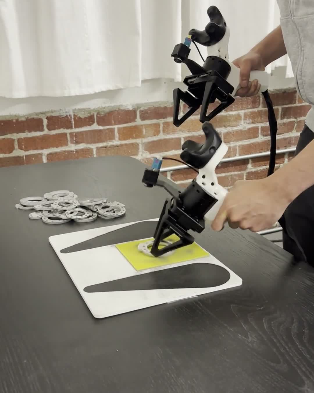 Mantis UMI grippers collecting a bimanual manipulation demonstration
